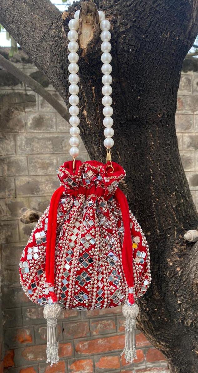 Wedding Wear Pearl Handle And Mirror Work Potli Bag Wholesale  Suppliers In India
